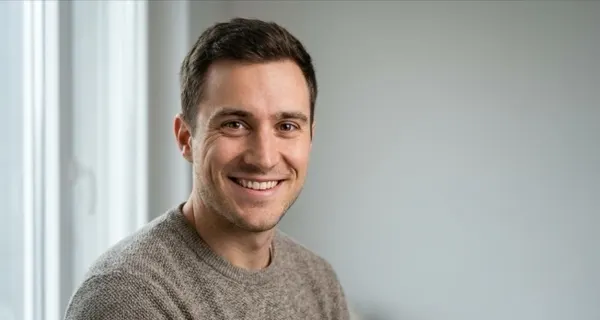 Example lead photo: smiling man in soft window light