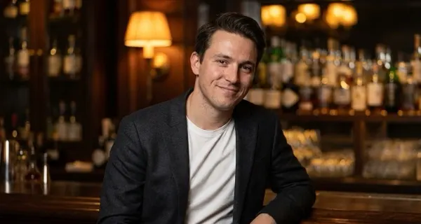 Example dressed-up photo: man in a blazer at a bar